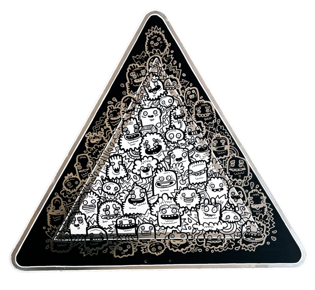 Monsters on the Loose, triangular street sign densely covered with black and white monster figures