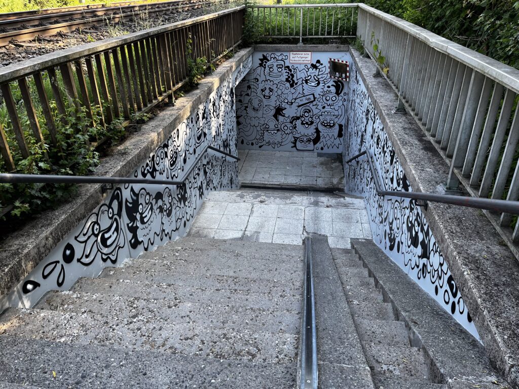 Public art by Fatin Rahmouni transforming a pedestrian underpass in Radolfzell into a colourful, site-specific urban artwork.